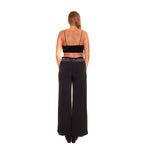 Arriendo de Crop top plush negro y pantalón laycra