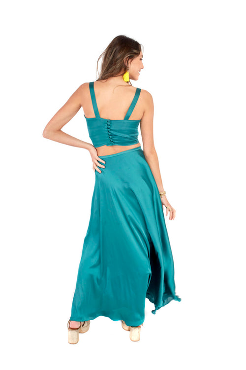 Arriendo de Conjunto de dos piezas, pollera esmeralda de seda y top con botones forrados en espalda