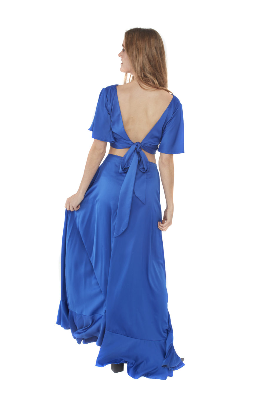 Arriendo de Conjunto de dos piezas. pollera azul con vuelos abajo y top azul con manguitas y amarre en espalda