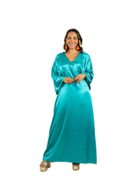 Arriendo de Vestido largo de seda turquesa con mangas