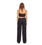 Arriendo de Top negro con detalles naranjos y dorados y pantalón negro