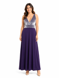Arriendo de Vestido largo morado de terciopelo en parte de arriba y lycra abajo con pabilos