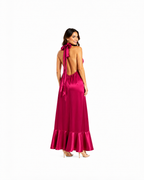 Arriendo de Vestido largo de seda fucsia cuello halter con vuelos abajo y elastizado en espalda