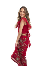 Arriendo de Conjunto Roca top y pollera rojo con mostacillas