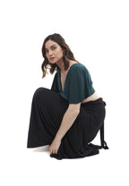 Arriendo de Conjunto lycra top verde oscuro manga angel con pollera negra