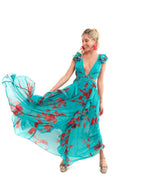 Arriendo de Vestido largo Luxxell vuelos mangas color turquesa con flores rojas
