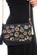 Arriendo de Arriendo de Cartera negra con mostacillas doradas y negras como animal print