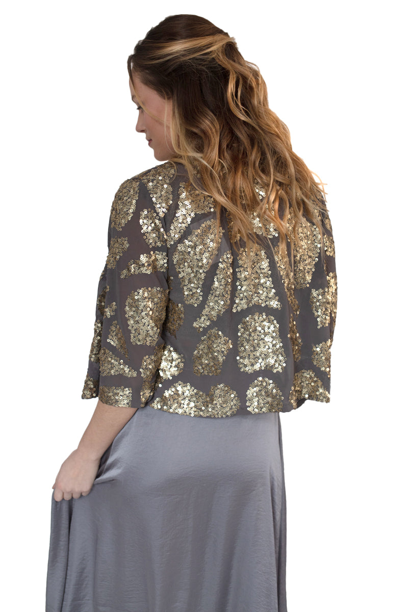 Arriendo de Chaqueta cafe con brillos y lentejuelas doradas