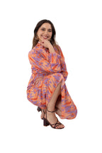Arriendo de Vestido largo con manga larga naranjo con estampado lila con botones de gasa