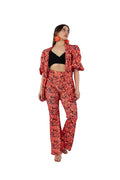 Arriendo de Conjunto de dos piezas, Chaqueta con hombreras y pantalón con estampado naranjo, negro y fucsia