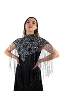 Arriendo de Poncho negro con bordado de mostacillas plateadas